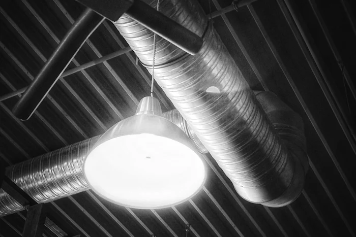 Spiral duct hung below a metal roof deck